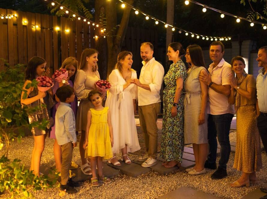 Bride and a groom surrounded by family at their micro wedding. 